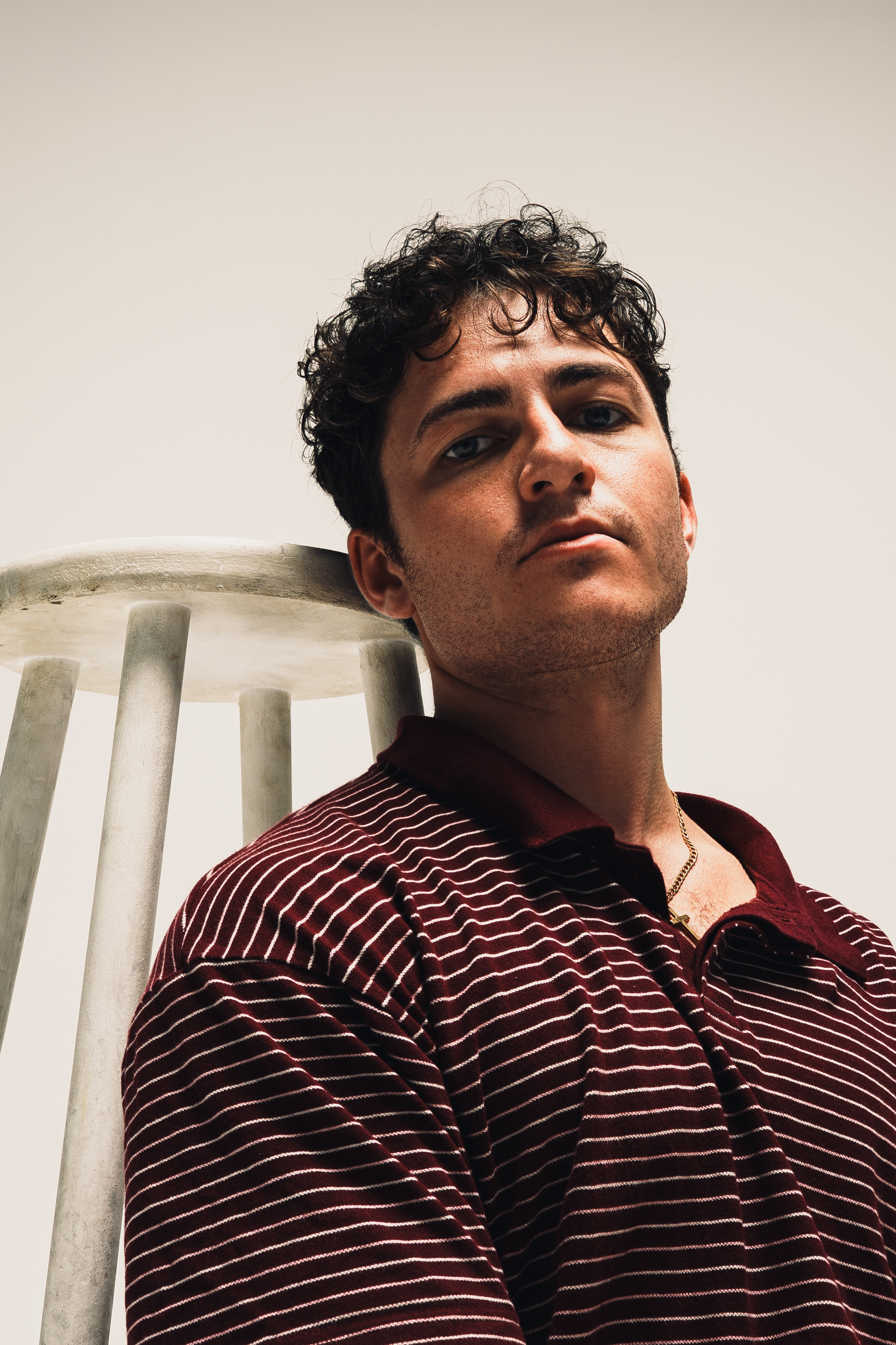 Lifestyle photography — silhouette of man walking through golden field at sunset