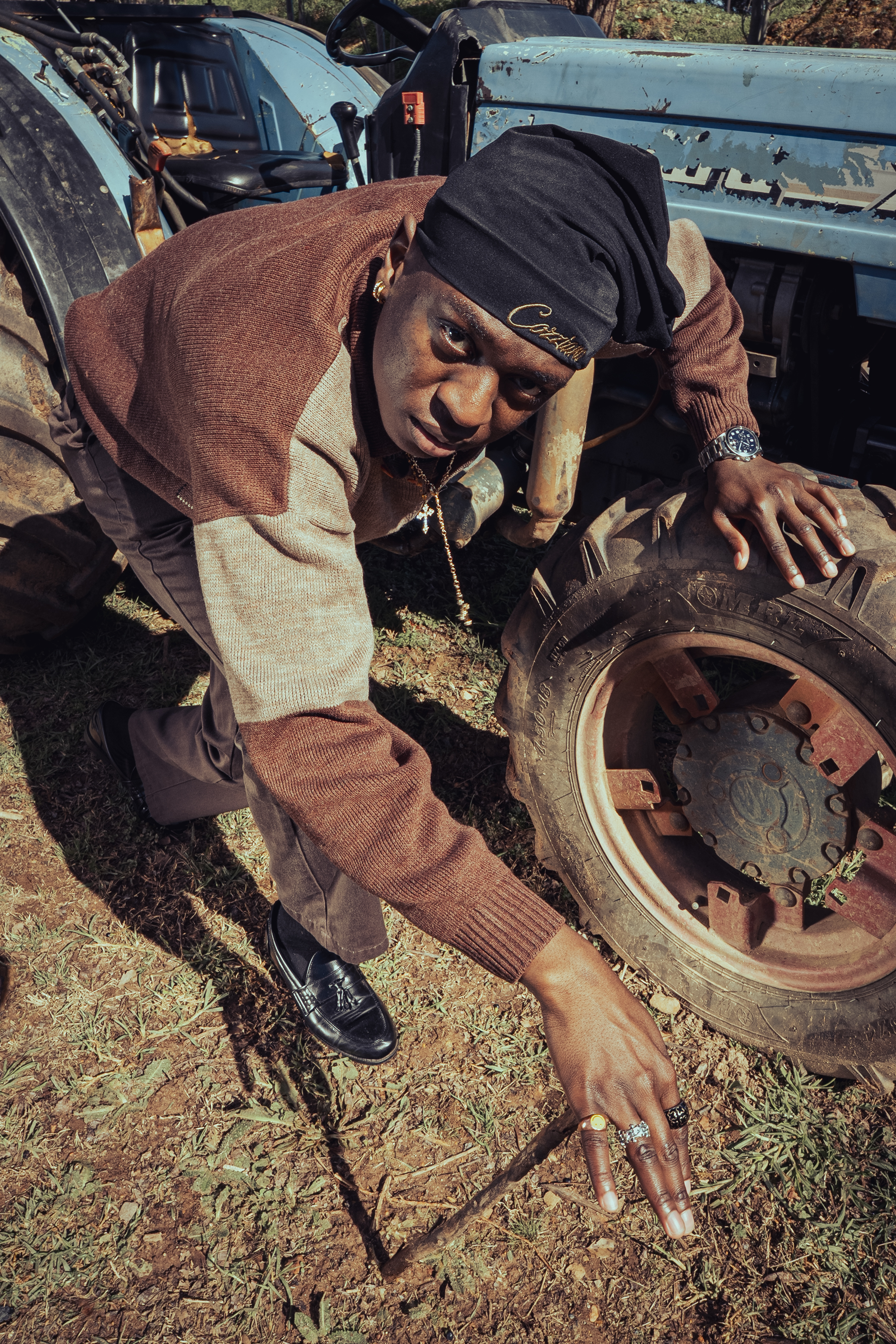 Documentary photography — woman with camera surrounded by hanging glass jars
