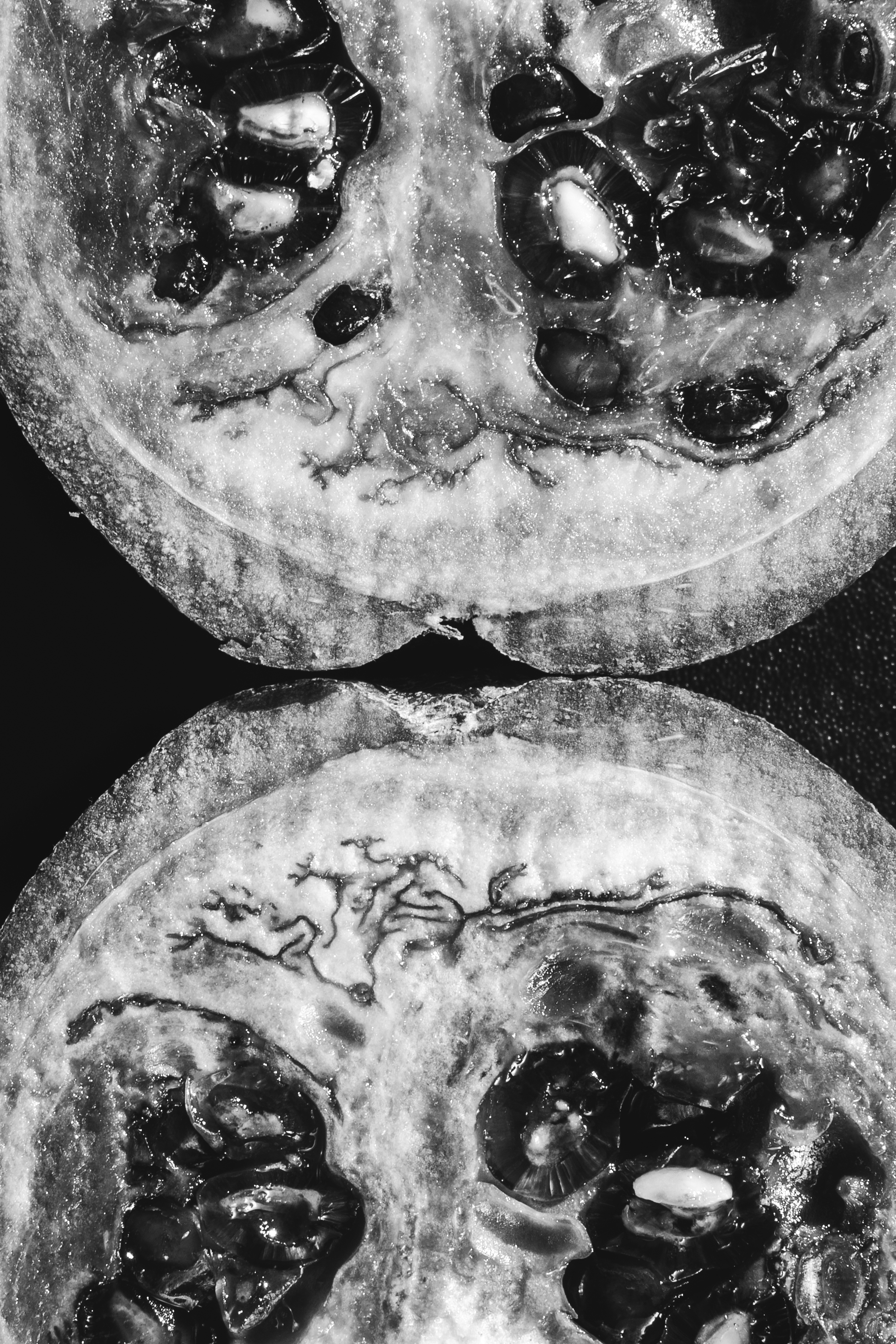 Portrait photography — woman sitting on rooftop with mountain backdrop at dusk