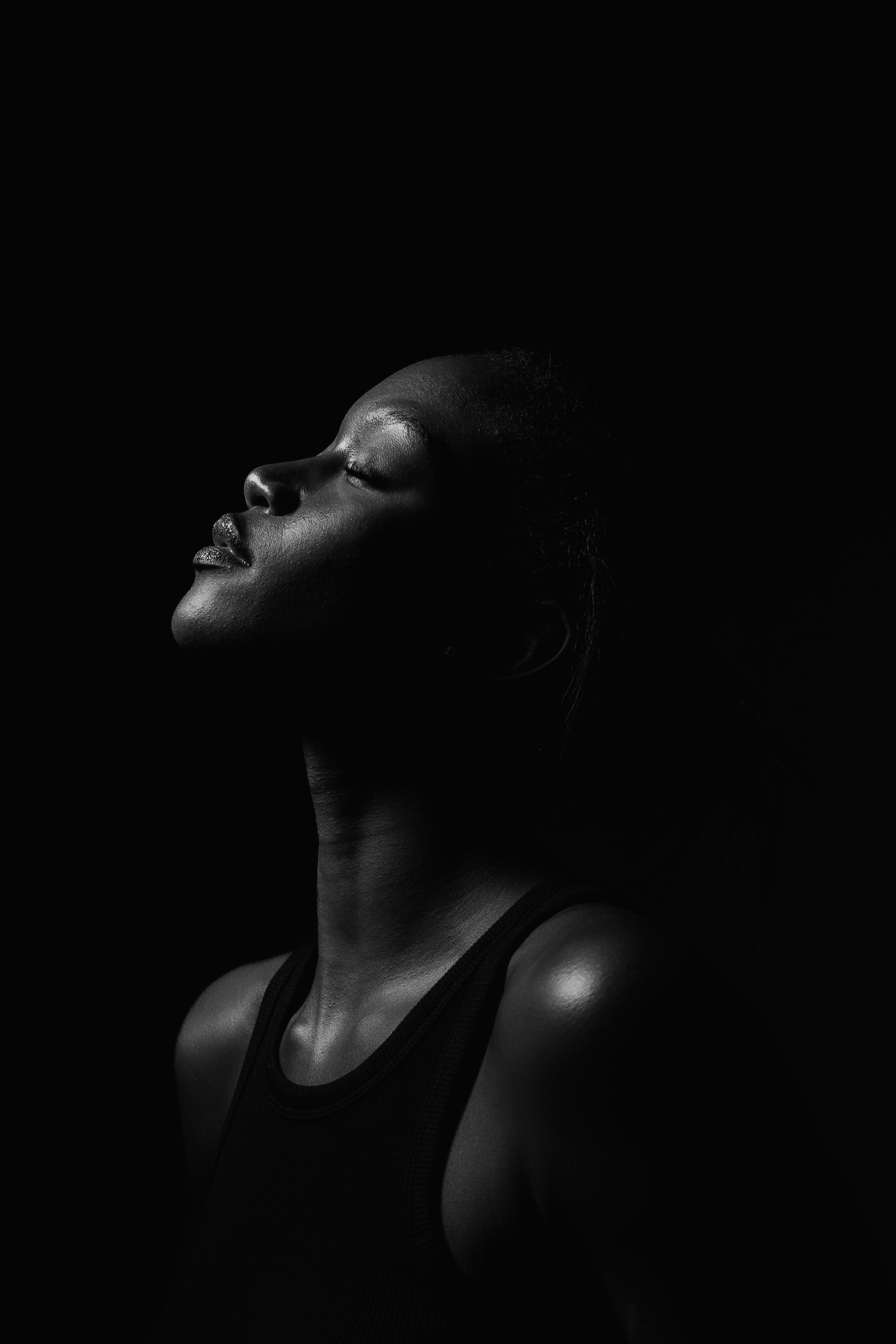 Portrait photography — man leaning against stool in natural light